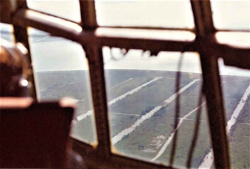 This image has an empty alt attribute; its file name is Tinian-003-2mb-Looking-out-of-the-right-side-of-the-flight-deck-windows-to-the-north-1976-Madden-Photo-1024x694.jpg